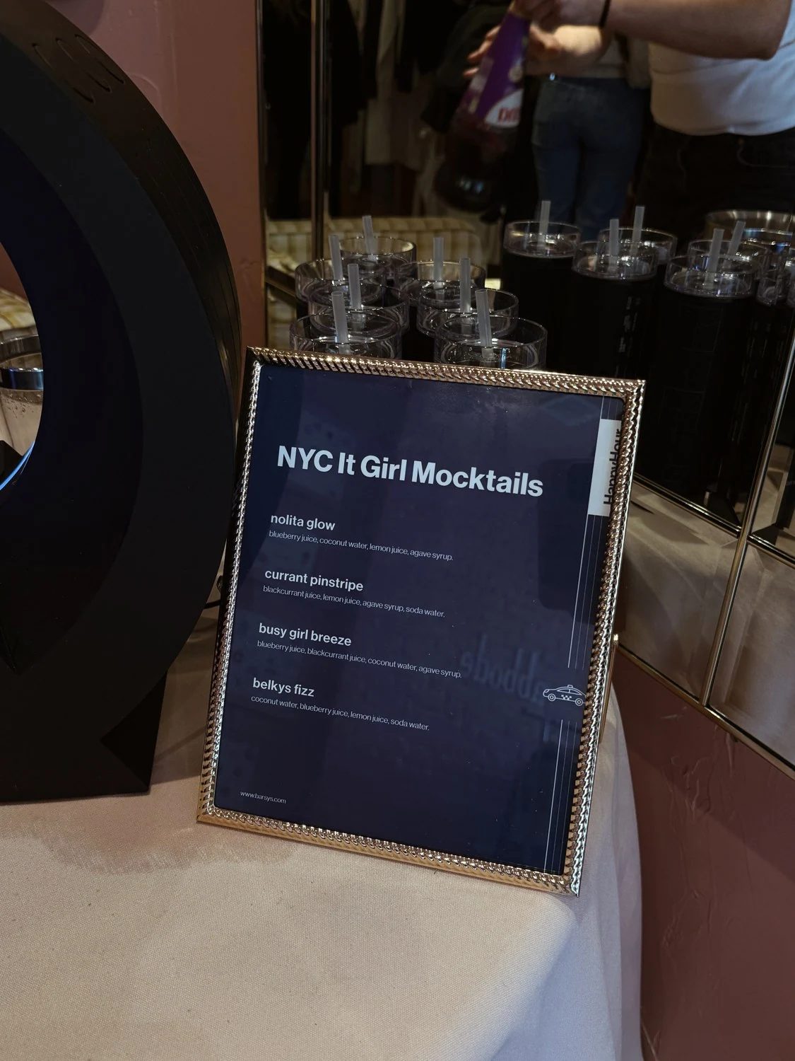 An event-specific printed mocktail menu beside the Barsys machine at the Abbode pop-up.