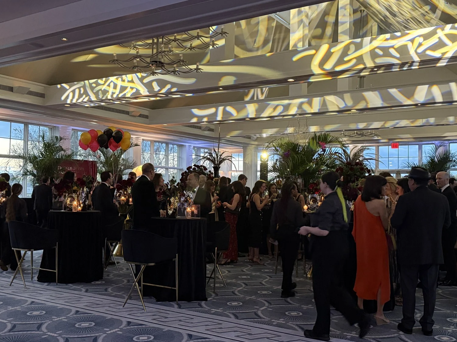 Guests gathered in a decorated ballroom during the Scarsdale Library gala.
