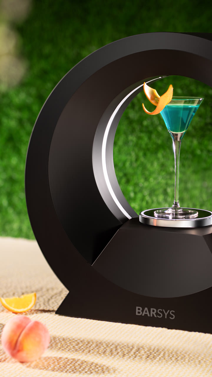 A Barsys 360 with a blue coupe cocktail on a sunny garden table.