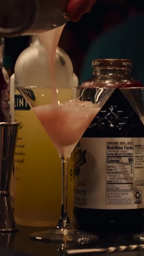 Pouring, shaking, straining and service from NYC Deliverable 4. Showing the bartender's finishing work; exact recipes are not specified. Silent event footage.
