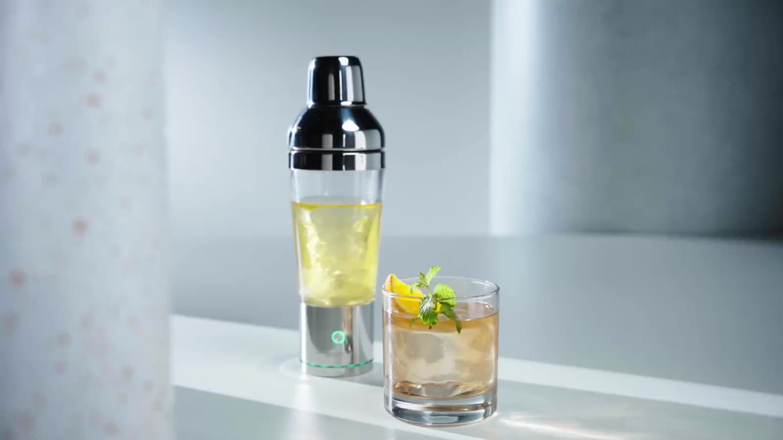 The Shaker Pro on its illuminated base, ready for a light-guided pour.